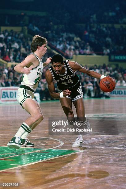 George Gervin of the San Antonio Spurs drives to the basket against Danny Ainge of the Boston Celtics during a game played in 1983 at the Boston...