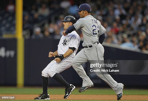 Brett Gardner of the New York Yankees is run down by Carlos Pena of the Tampa Bay Rays at Yankee Stadium on May 19, 2010 in the Bronx borough of New...