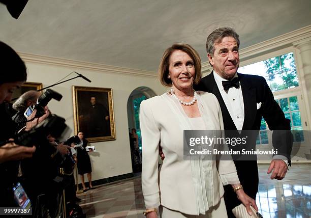 Speaker of the House Nancy Pelosi and husband Paul Pelosi arrive at the White House for a state dinner May 19, 2010 in Washington, DC. President...