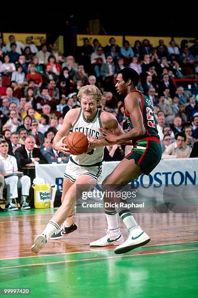 Larry Bird of the Boston Celtics drives to the basket against the Milwaukee Bucks during a game played in 1983 at the Boston Garden in Boston,...