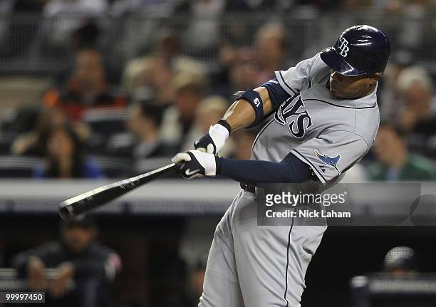 Carl Crawford of the Tampa Bay Rays hits an RBI double against the New York Yankees at Yankee Stadium on May 19, 2010 in the Bronx borough of New...