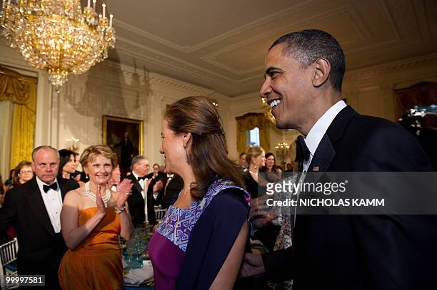 President Barack Obama and Mexican First Lady Margarita Zavala enter the East Room of the White House for a state dinner in honor of Mexican...