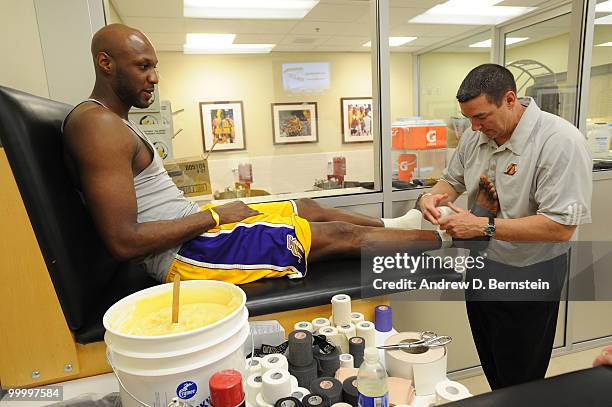 Lamar Odom of the Los Angeles Lakers has his ankle taped before taking on the Phoenix Suns in Game Two of the Western Conference Finals during the...