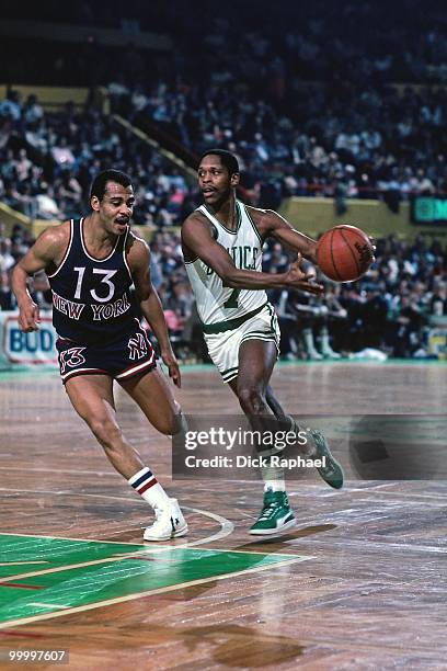 Nate "Tiny" Archibald of the Boston Celtics drives to the basket against Ed Sherod of the New York Knicks during a game played in 1983 at the Boston...