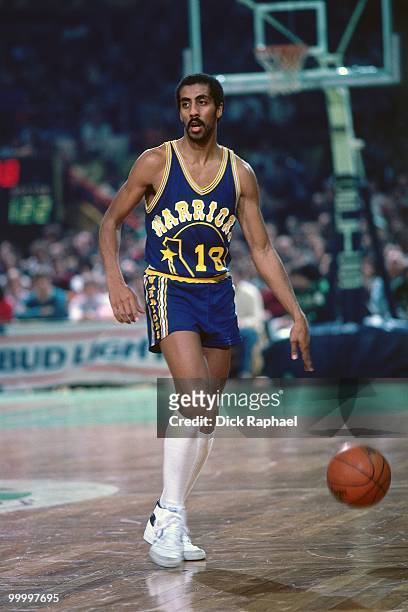 Lorenzo Romar of the Golden State Warriors moves the ball up court against the Boston Celtics during a game played in 1983 at the Boston Garden in...