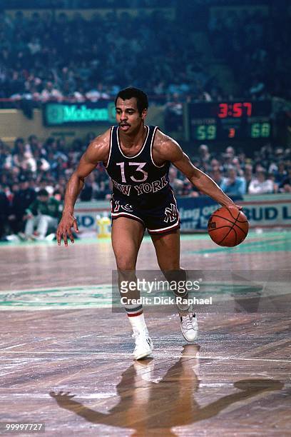 Ed Sherod of the New York Knicks moves the ball up court against the Boston Celtics during a game played in 1983 at the Boston Garden in Boston,...