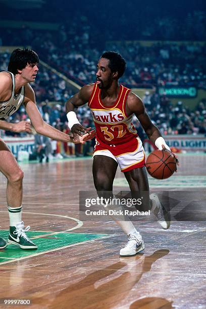 Dan Roundfield of the Atlanta Hawks drives to the basket against Kevin McHale of the Boston Celtics during a game played in 1983 at the Boston Garden...