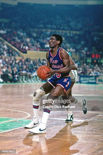 Albert King of the New Jersey Nets looks to make a play against the Boston Celtics during a game played in 1983 at the Boston Garden in Boston,...