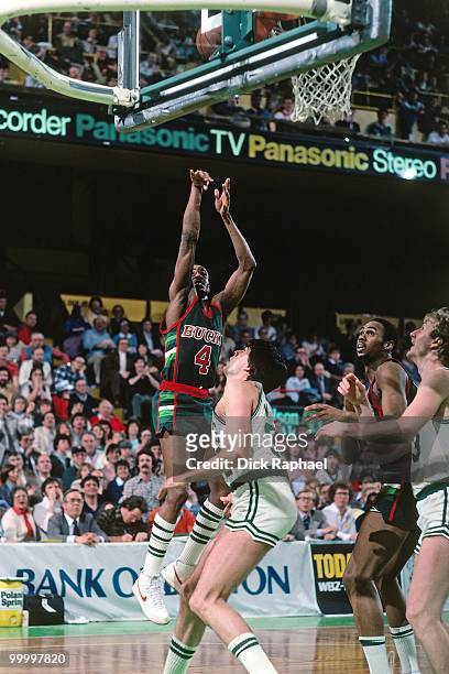 Sidney Moncrief of the Milwaukee Bucks shoots over Kevin McHale of the Boston Celtics during a game played in 1983 at the Boston Garden in Boston,...