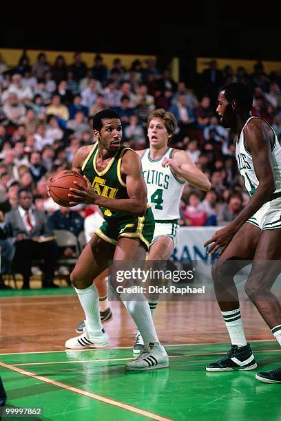 Adrian Dantley of the Utah Jazz looks to make a move against the Boston Celtics during a game played in 1983 at the Boston Garden in Boston,...