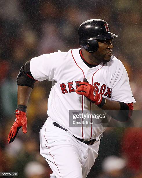 David Ortiz of the Boston Red Sox rounds first base in the fourth inning against the Minnesota Twins on May 19, 2010 at Fenway Park in Boston,...