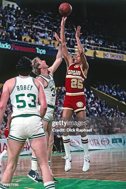 Darren Tillis of the Cleveland Cavaliers shoots over Larry Bird and Rick Robey of the Boston Celtics during a game played in 1983 at the Boston...