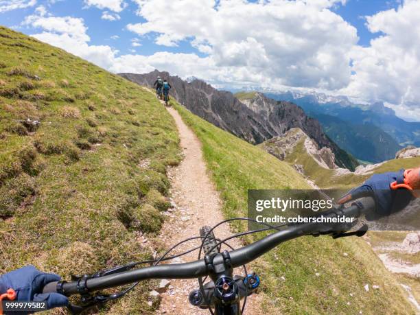 three men mountain biking, fanes-sennes-braies national park, dolomites, trentino, south tyrol, italy - extreme sports point of view stock pictures, royalty-free photos & images