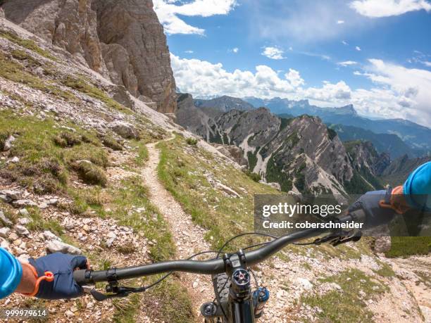 man mountain biking, fanes-sennes-braies national park, dolomites, trentino, south tyrol, italy - extreme sports point of view stock pictures, royalty-free photos & images