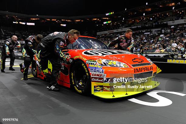 The DuPont Chevrolet pit crew race during the NASCAR Sprint Pit Crew Challenge at Time Warner Cable Arena on May 19, 2010 in Charlotte, North...
