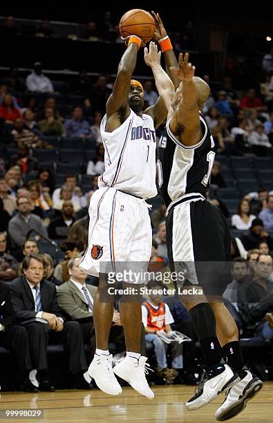 Stephen Jackson of the Charlotte Bobcats shoots over Keith Bogans of the San Antonio Spurs during the game on January 15, 2010 at Time Warner Cable...