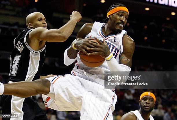 Gerald Wallace of the Charlotte Bobcats comes down with a rebound over Richard Jefferson of the San Antonio Spurs during the game on January 15, 2010...