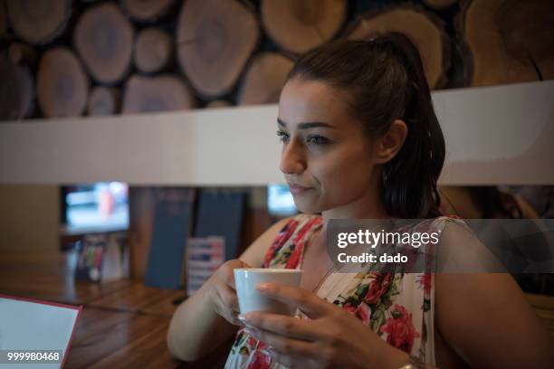 woman enjoying a cup of coffee - dado stock pictures, royalty-free photos & images