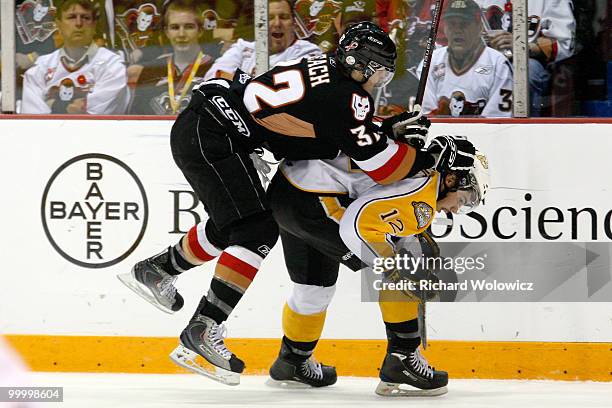 Cody Beach of the Calgary Hitmen body checks Travis Hamonic of the Brandon Wheat Kings during the 2010 Mastercard Memorial Cup Tournament at the...