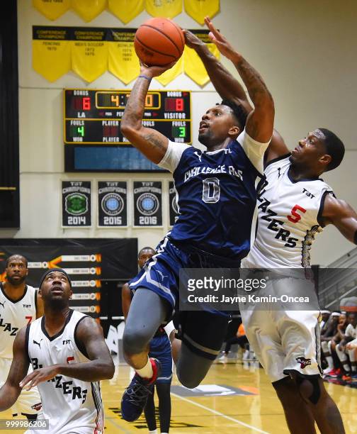 Franklin Robinson of the Citi Team Blazers defends a shot by E.J. Rowland of Team Challenge ALS in the Western Regional of The Basketball Tournament...