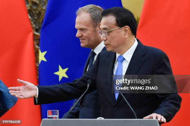 Chinese Premier Li Keqiang and European Council President Donald Tusk attend a joint press conference at the Great Hall of the People in Beijing on...