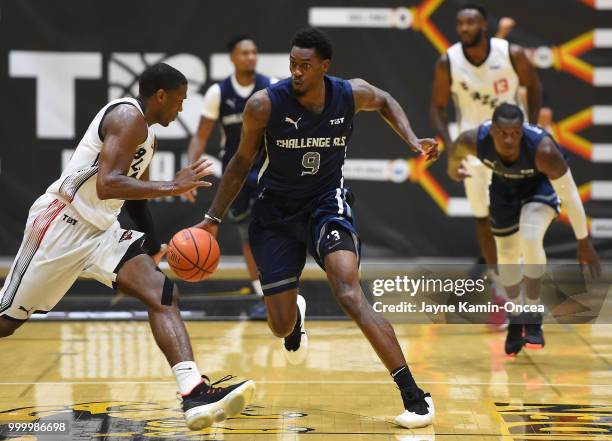 Franklin Robinson of the Citi Team Blazers guards Deshawn Stephens of Team Challenge ALS as he takes the ball down court during the Western Regional...