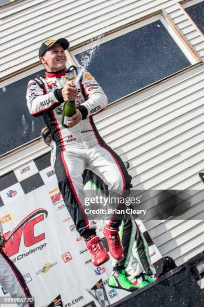 Scott Hargrove of Canada celebrates with champagne after the Pirelli World Challenge GT race at Portland International Raceway on July 15, 2018 in...