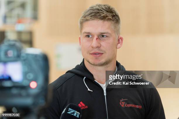 Jack Goodhue speaks to the media following a Crusaders Super Rugby training session at St Andrew's College on July 16, 2018 in Christchurch, New...