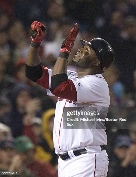 David Ortiz of the Boston Red Sox celebrates after hitting a home run against the Minnesota Twins in the fourth inning on May 19, 2010 at Fenway Park...