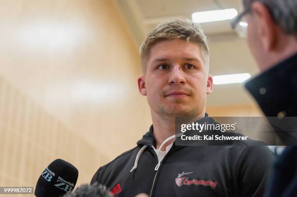 Jack Goodhue speaks to the media following a Crusaders Super Rugby training session at St Andrew's College on July 16, 2018 in Christchurch, New...