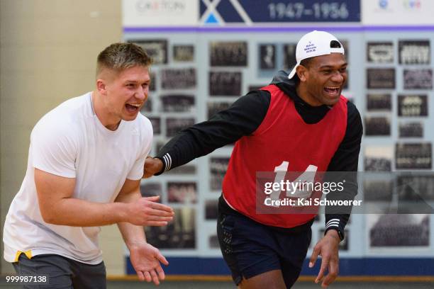 Jack Goodhue and Seta Tamanivalu react during a Crusaders Super Rugby training session at St Andrew's College on July 16, 2018 in Christchurch, New...