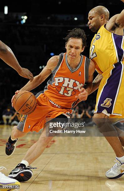 Steve Nash of the Phoenix Suns drives with the ball against Derek Fisher of the Los Angeles Lakers in Game Two of the Western Conference Finals...