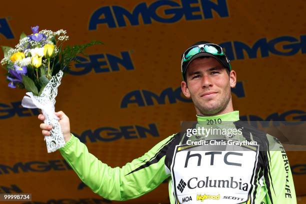 Mark Cavendish of Great Britian, riding for HTC-Columbia celebrates on the podium after winning the green points jersey after the fourth stage of the...
