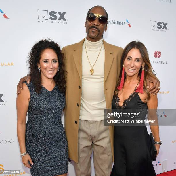 Constance Schwartz Morini, Snoop Dogg and executive board member of Sports Spectacular Beth Moskowitz attend the 33rd Annual Cedars-Sinai Sports...