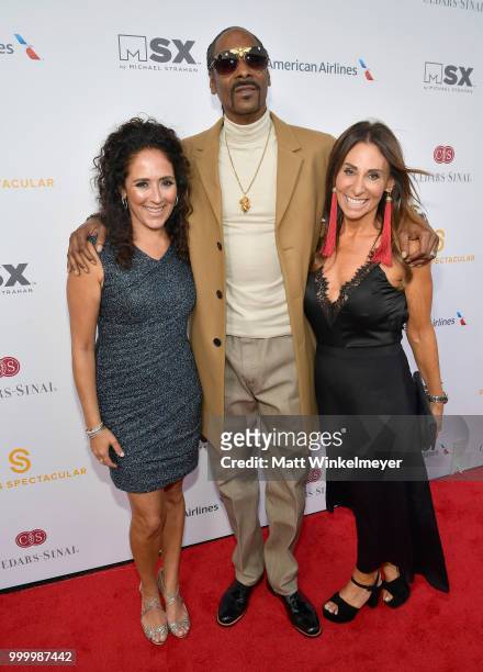 Constance Schwartz Morini, Snoop Dogg and executive board member of Sports Spectacular Beth Moskowitz attend the 33rd Annual Cedars-Sinai Sports...