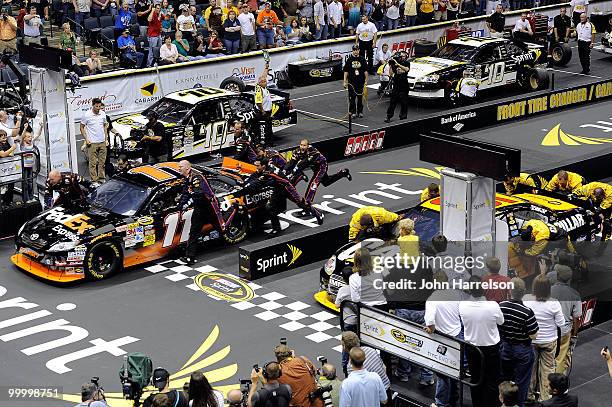The FedEx Freight Toyota pit crew defeat the Caterpillar Chevrolet pit crew to win the NASCAR Sprint Pit Crew Challenge at Time Warner Cable Arena on...