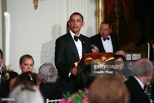President Barack Obama speaks at a state dinner held for visiting Mexican President Felipe Calderon and his wife Margarita Zavala at the White House...