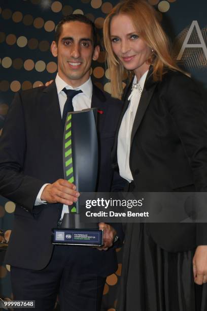 Sebastien Buemi, winner of the Fanboost award, and Uma Thurman attend the 2017/18 ABB FIA Formula E Championship Awards Dinner following the Formula...