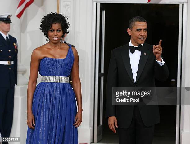 President Barack Obama and first lady Michelle Obama wait to greet Mexican President Felipe Calderon and his wife Margarita Zavala at the White House...