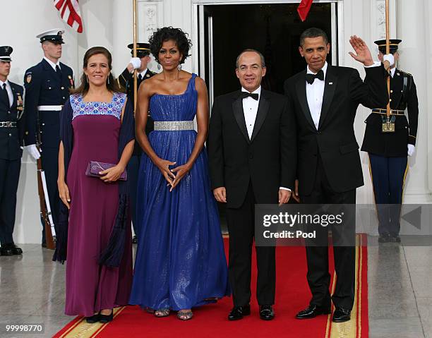 President Barack Obama and first lady Michelle Obama welcome Mexican President Felipe Calderon and his wife Margarita Zavala to the White House for a...