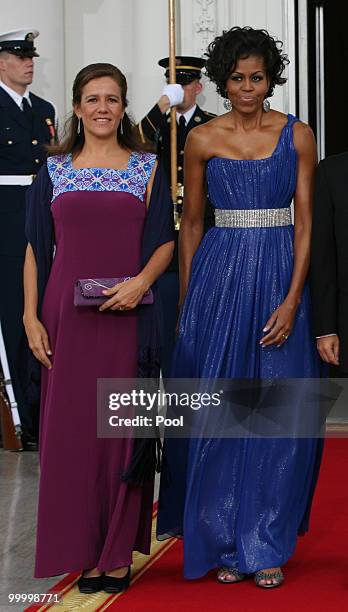 First lady Michelle Obama and Margarita Zavala, wife of Mexican President Felipe Calderon pose for photographers before a state dinner at the White...