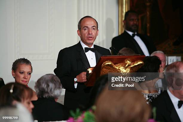 Mexican President Felipe Calderon speaks at a state dinner hosted by U.S. President Barack Obama and first lady Michelle Obama at the White House May...