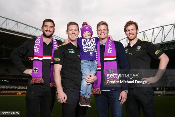 Bone Marrow Failure patient Elliott poses with Josh Bruce of the Saints Jack Riewoldt of the Tigers and his brother and St.Kilda Saints legend Nick...