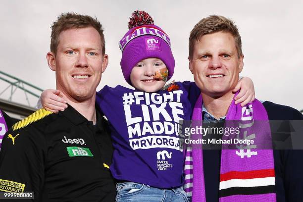 Bone Marrow Failure patient Elliott poses with Josh Bruce of the Saints Jack Riewoldt of the Tigers and his brother and St.Kilda Saints legend Nick...