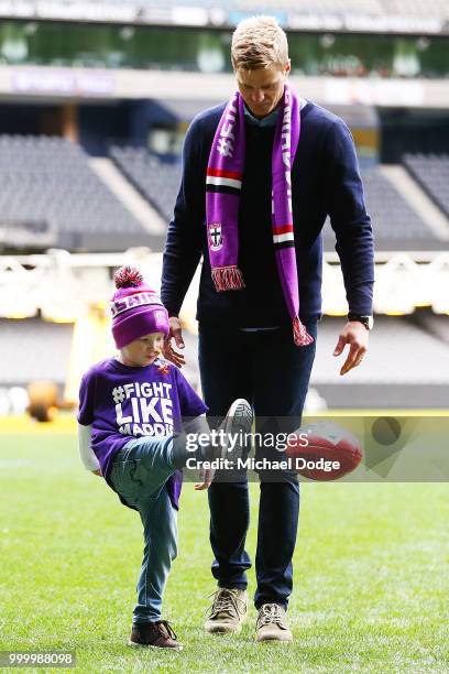 Bone Marrow Failure patient Elliott plays with St.Kilda Saints legend Nick Riewoldt during the Maddie's Match AFL Media Opportunity at Etihad Stadium...