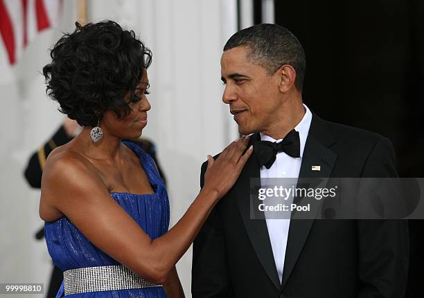 President Barack Obama and first lady Michelle Obama wait to greet Mexican President Felipe Calderon and his wife Margarita Zavala at the White House...