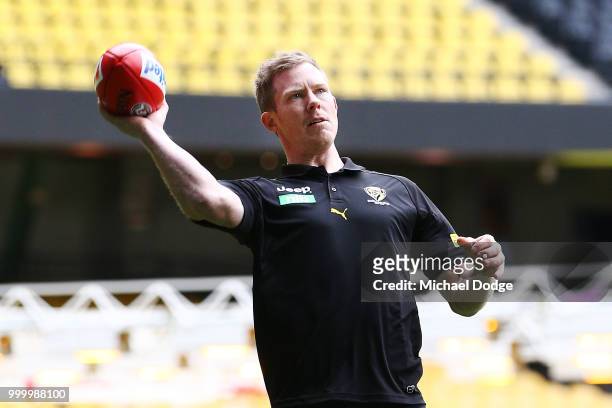 Jack Riewoldt of the Tigers throws the football during the Maddie's Match AFL Media Opportunity at Etihad Stadium on July 16, 2018 in Melbourne,...