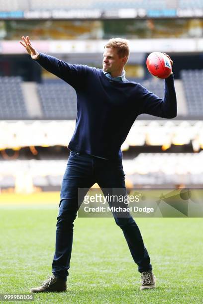 St.Kilda Saints legend Nick Riewoldt throws the football during the Maddie's Match AFL Media Opportunity at Etihad Stadium on July 16, 2018 in...