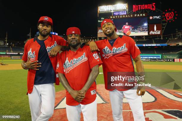 John Wall of the Washington Wizards, rapper Wale, and Josh Norman of the Washington Redskins pose during the Legends & Celebrity Softball Game at...