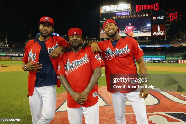 John Wall of the Washington Wizards, rapper Wale, and Josh Norman of the Washington Redskins pose during the Legends & Celebrity Softball Game at...